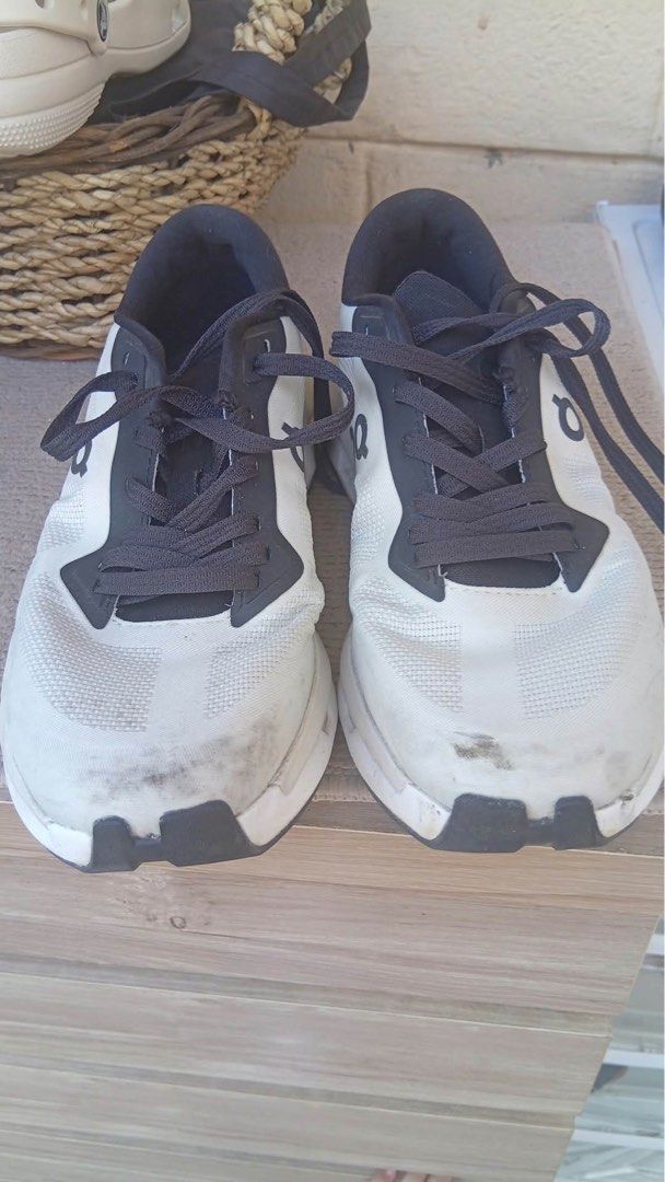 On Cloud Running Shoes White Black (Category: Sneakers) located in Muntinlupa City. Submitted by ashley.18 (Listing ID 1470767852, Image 1). Description: - Brand: On Running Shoes - Color: Classic White and Black - Style: Iconic Cloud design with convenient speed-lacing system - Material: Breathable mesh upper for maximum airflow - Condition: Good pre-owned condition with plenty of tread left on rubber outsoles - Flaws: Visible scuffs/dirt marks 