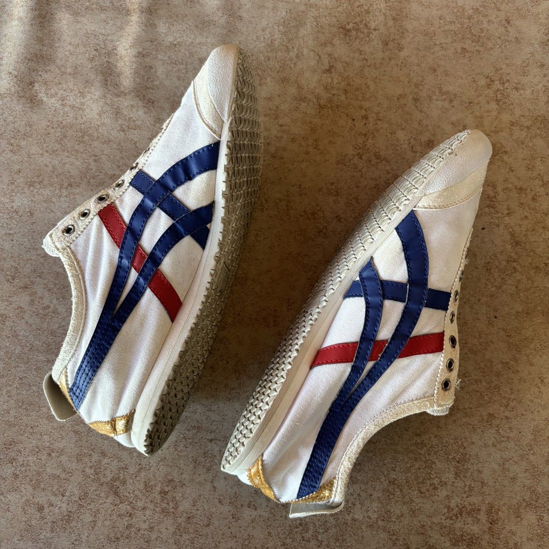 Onitsuka Tiger Mexico 66 White Blue Red (Category: Casual Shoes) located in Dipolog. Submitted by dionato (Listing ID 1470821468, Image 2). Description: - Brand: Onitsuka Tiger - Model: Mexico 66 Canvas Sneakers - Colorway: White base with blue/gold stripes and red accents - Features: Gold heel tab with red embroidered Tiger logo, metal eyelets, and classic low-top design - Condition: Pre-owned with slight dirt on the textured rubber outer soles 
