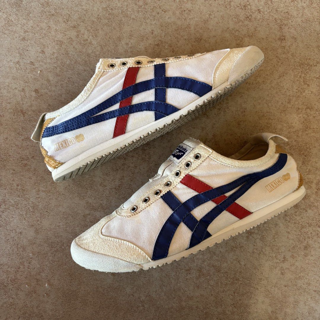 Onitsuka Tiger Mexico 66 White Blue Red (Category: Casual Shoes) located in Dipolog. Submitted by dionato (Listing ID 1470821468, Image 1). Description: - Brand: Onitsuka Tiger - Model: Mexico 66 Canvas Sneakers - Colorway: White base with blue/gold stripes and red accents - Features: Gold heel tab with red embroidered Tiger logo, metal eyelets, and classic low-top design - Condition: Pre-owned with slight dirt on the textured rubber outer soles 