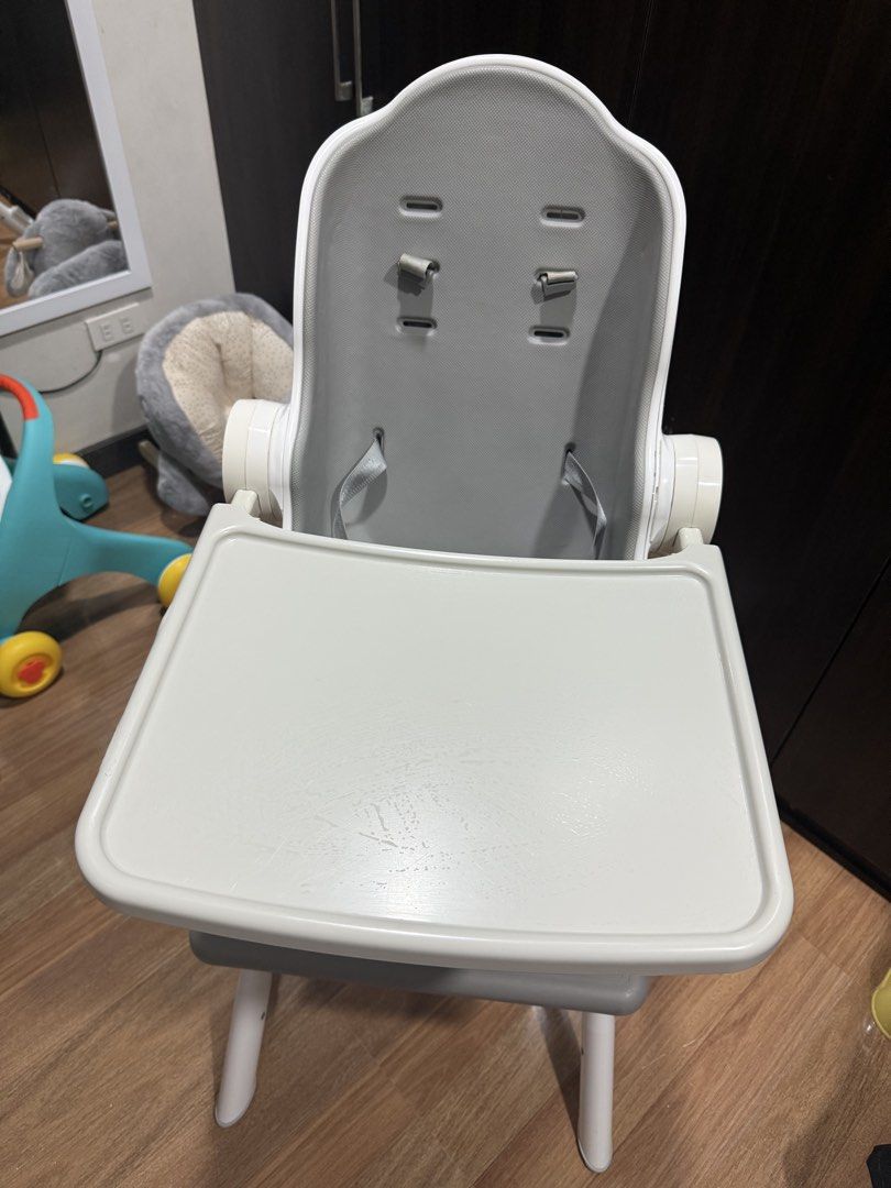 Oribel cocoon z high chair (Category: Baby High Chairs) located in Pasig City. Submitted by myclosetdiaries_ (Listing ID 1470919243, Image 2). Description: - Brand/Model: Oribel Cocoon Z High Chair in white and gray - Includes comfortable 2-in-1 seat cushion - Cosmetic issue: Sun-exposure burn mark on the right side of the table tray (does not affect usage or stability) - Secure harness system and adjustable footrest - Meetup available in Pasig C