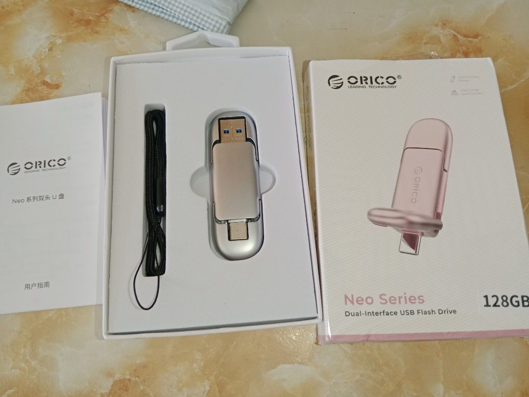 Orico 128gb neo series dual interface usb flash drive (Category: Desktops) located in Bayambang. Submitted by lucky_faststar_74a229 (Listing ID 1470758071, Image 2). Description: - Brand: Orico Neo Series Dual Interface USB Flash Drive - Capacity: 128GB large storage space - Design: Sleek silver metallic finish with dual connectors - Inclusions: Original retail box, user manual, and black lanyard - Compatibility: Perfect for transferring files be