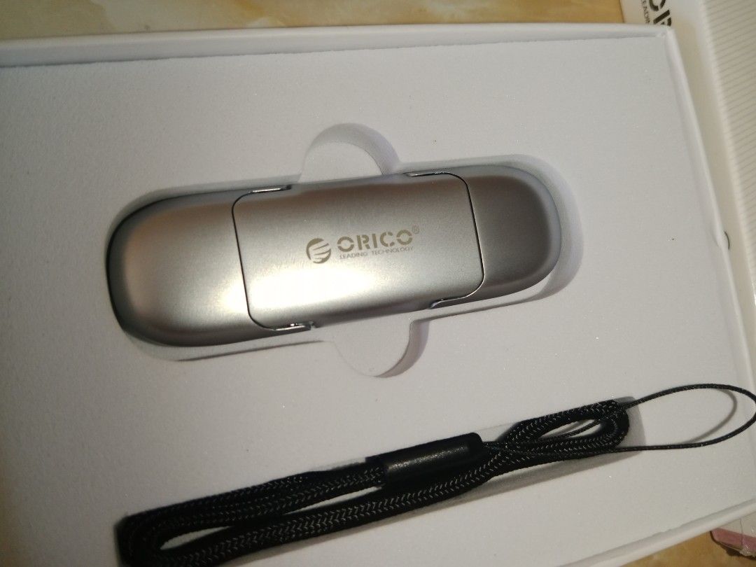 Orico 128gb neo series dual interface usb flash drive (Category: Desktops) located in Bayambang. Submitted by lucky_faststar_74a229 (Listing ID 1470758071, Image 3). Description: - Brand: Orico Neo Series Dual Interface USB Flash Drive - Capacity: 128GB large storage space - Design: Sleek silver metallic finish with dual connectors - Inclusions: Original retail box, user manual, and black lanyard - Compatibility: Perfect for transferring files be