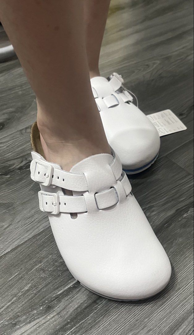 Original Birkenstock Kay Pro White Clogs Size 36 (Category: Slippers and slides) located in Manila. Submitted by nadhinesglamourshop (Listing ID 1470896269, Image 3). Description: White Birkenstock Kay Pro clogs. Size 36. Features a white leather upper with two adjustable straps. The footbed is made of natural cork. The sole is white with a blue stripe. Comes with the original box..