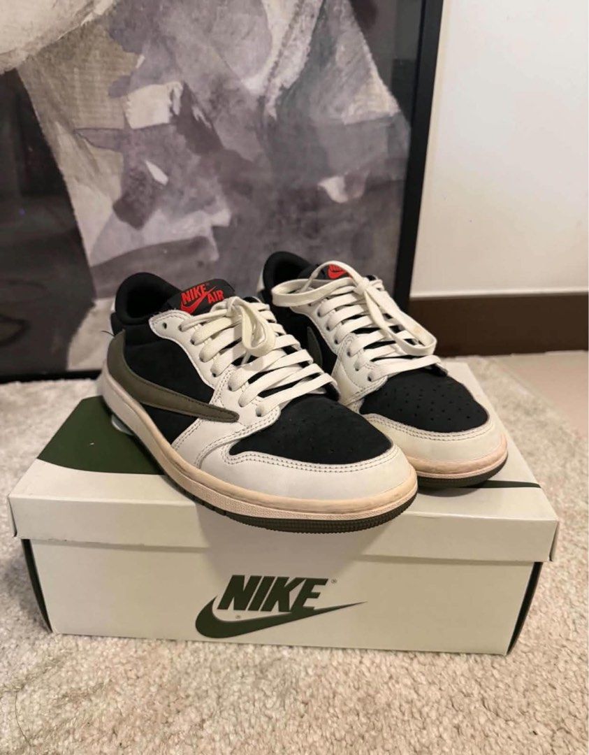Original JORDAN 1 LOW OG SP (Category: Sneakers) located in Las Pinas. Submitted by calliahscorner (Listing ID 1470899856, Image 3). Description: - Brand: Jordan - Model: Jordan 1 Low OG SP - Size: EU 40 / US 7 - Colorway: Black, White, and Olive with striking red Nike Air tongue branding - Features: Iconic reverse swoosh design, premium suede/leather materials - Inclusion: Complete with original special box and extra laces (black, red, olive) - 