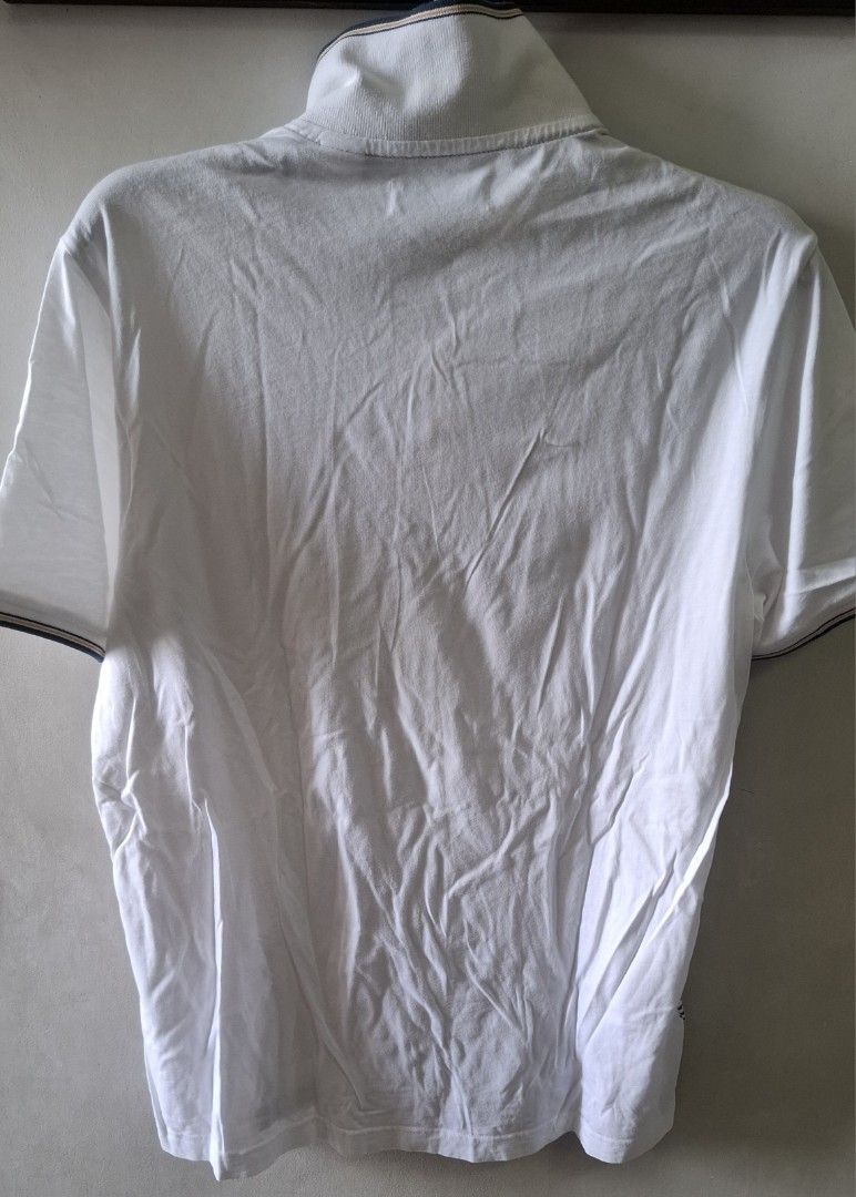 Original Penguin Patterned Polo Shirt (Category: Tshirts & Polo Shirts ) located in Taguig. Submitted by atticusmerch (Listing ID 1470779755, Image 2). Description: - Brand: Original Penguin - Color: White with geometric half-circle pattern on front (solid white back and sleeves) - Material: 100% Cotton, machine washable - Fit: Standard fit - Features: Short sleeves, button placket, collar with contrast piping - Condition: Brand new / Excellent q
