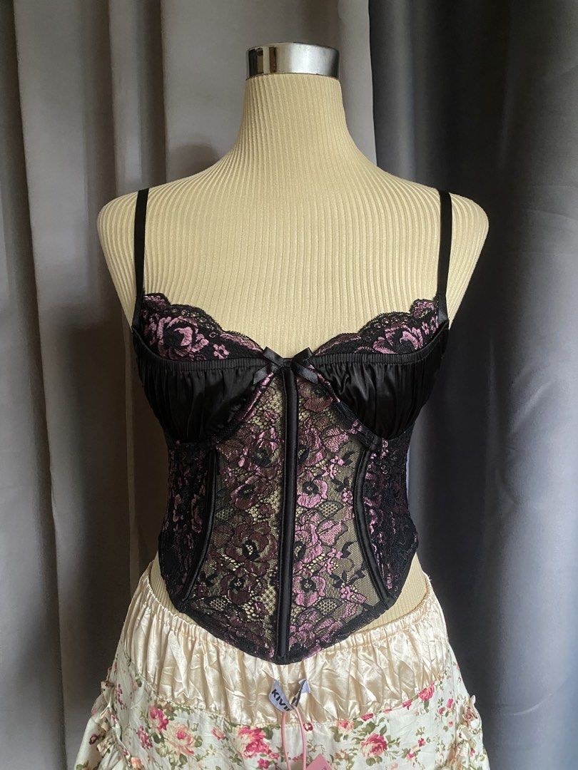 Outcast Black & Pink Lace Panel Corset Top (Category: Sleeveless) located in Cagayan de Oro. Submitted by curated_closetph (Listing ID 1470747137, Image 3). Description: — Size: XS - S — Color: Black / Pink — Sheer floral lace panels with a satin-finish bust and center bow — Sweetheart neckline with underwire cups and adjustable straps — Lace-up string tie back closure — Sharp pointed asymmetrical hem — Fully structured bodice lines — Can negotia