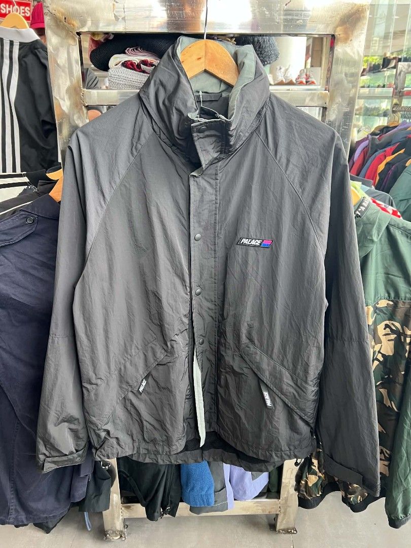 Palace Black Nylon Windbreaker Jacket (Category: Coats, Jackets and Outerwear) located in Urdaneta. Submitted by jayceegarage (Listing ID 1470882152, Image 1). Description: - Authentic Black Palace nylon jacket - Contrast patch logo on chest and back collar - Full zip front with snap button storm flap - Breathable mesh inner lining - High collar with Velcro closure tab - Deep side pockets with branded pulls - Lightweight, ideal for layering - Con