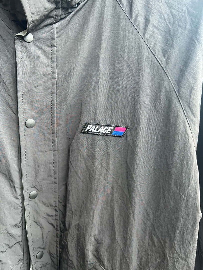 Palace Black Nylon Windbreaker Jacket (Category: Coats, Jackets and Outerwear) located in Urdaneta. Submitted by jayceegarage (Listing ID 1470882152, Image 3). Description: - Authentic Black Palace nylon jacket - Contrast patch logo on chest and back collar - Full zip front with snap button storm flap - Breathable mesh inner lining - High collar with Velcro closure tab - Deep side pockets with branded pulls - Lightweight, ideal for layering - Con