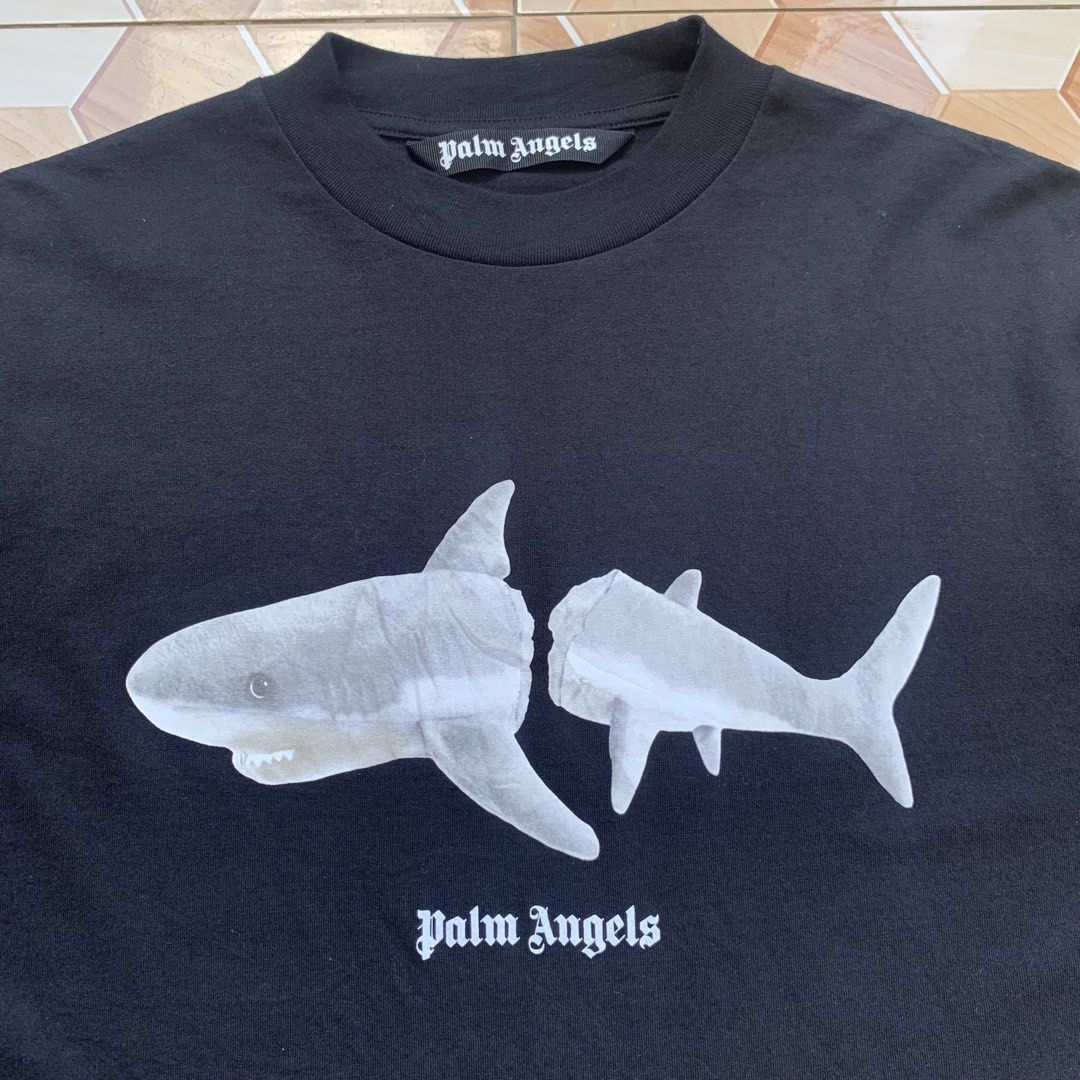 Palm Angels Shark Tee❗️ (Category: Tshirts & Polo Shirts ) located in Cebu City. Submitted by darrylopon12219 (Listing ID 1470754495, Image 3). Description: Orig💯 As New Condition No Issue Size Small to Medium Color Rate:10/10 Dimes:W19.5 L28 -Eco Friendly -Need Wash 📍 CONSOLACION, CEBU ‎🚚 ship via J&T ‎DM NOW📩.