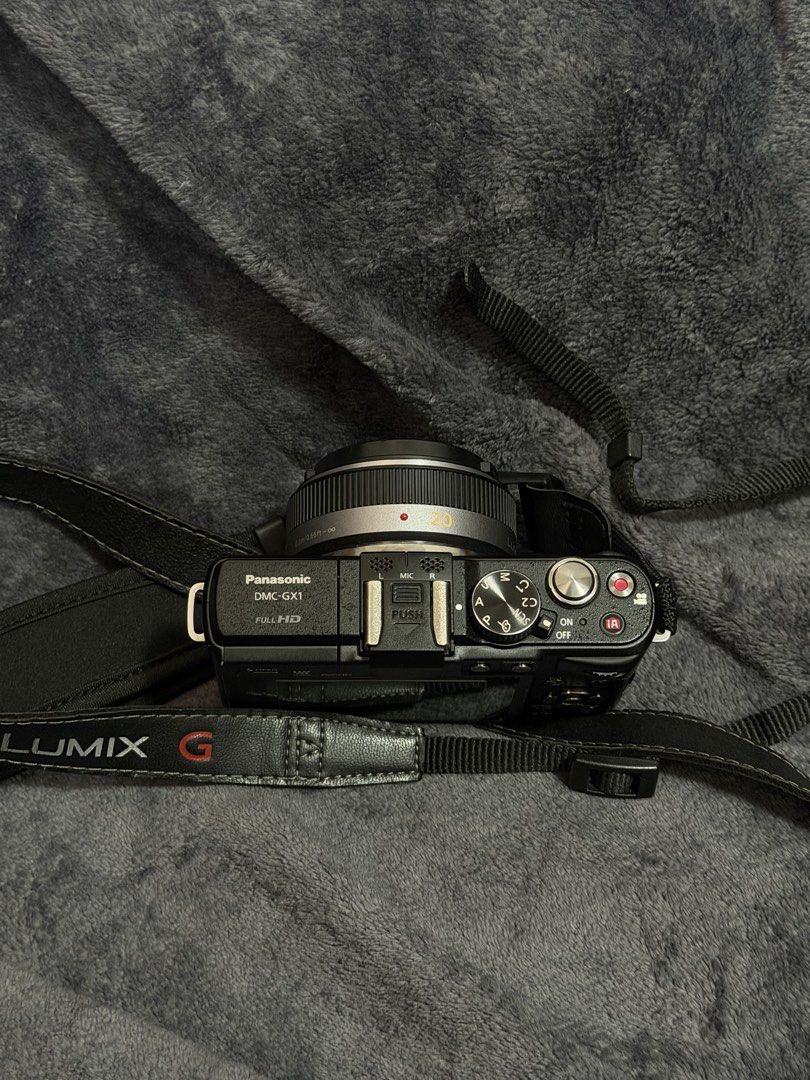Panasonic Lumix DMC-GX1 Mirrorless Camera with Strap (Category: Cameras) located in Las Pinas. Submitted by myqanorella (Listing ID 1470930543, Image 3). Description: - Model: Panasonic Lumix DMC-GX1 Mirrorless Camera (Black) - LANGUAGE: Japanese (NO BUILT IN LANGUAGE CHANGER) - Format: Compact Micro Four Thirds body with low-profile lens - Included: LUMIX G branded neck strap and lens cap - Condition: Fully functional dials, buttons, and rear sc