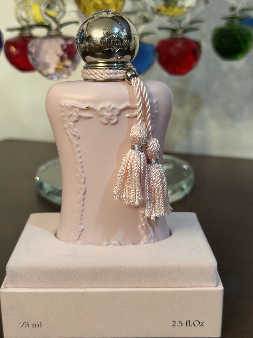 Parfums de Marly Delina Eau de Parfum 75ml (Category: Fragrance & Deodorants) located in Quezon City. Submitted by mommaofthreeaidans (Listing ID 1470750043, Image 1). Description: - Authentic Parfums de Marly Delina Eau de Parfum - Generous 75ml bottle size - Iconic fragrance featuring luxurious notes of rose and lychee - Comes with the original outer packaging box - Includes signature decorative tassels and metallic cap with embedded crystal de