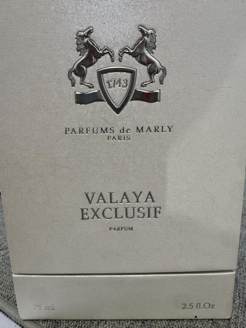 Parfums de Marly Valaya Exclusif Parfum 75ml (Category: Fragrance & Deodorants) located in Marikina City. Submitted by potchayy (Listing ID 1470881326, Image 1). Description: Parfums de Marly Valaya Exclusif parfum bottle in 75ml / 2.5 fl.oz size. Frosted glass bottle with decorative cap and white braided cord detail around the neck. Batch number 505663A stamped on the bottom and matching box. Includes the original textured outer box with batch c