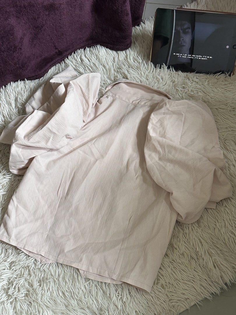 Pastel pink button down blouse with puff sleeves (Category: Blouses) located in Taguig. Submitted by appatheseller (Listing ID 1470846340, Image 2). Description: Fits M-L Color: Pastel pink - Style: Button-down shirt with standard collar - Sleeves: Puff sleeves with gathered details - Fabric: Soft textured fabric with a subtle sheen - Closure: Front button closure - Versatility: Pairs easily with skirts or high-waisted jeans - Condition: Clean fi