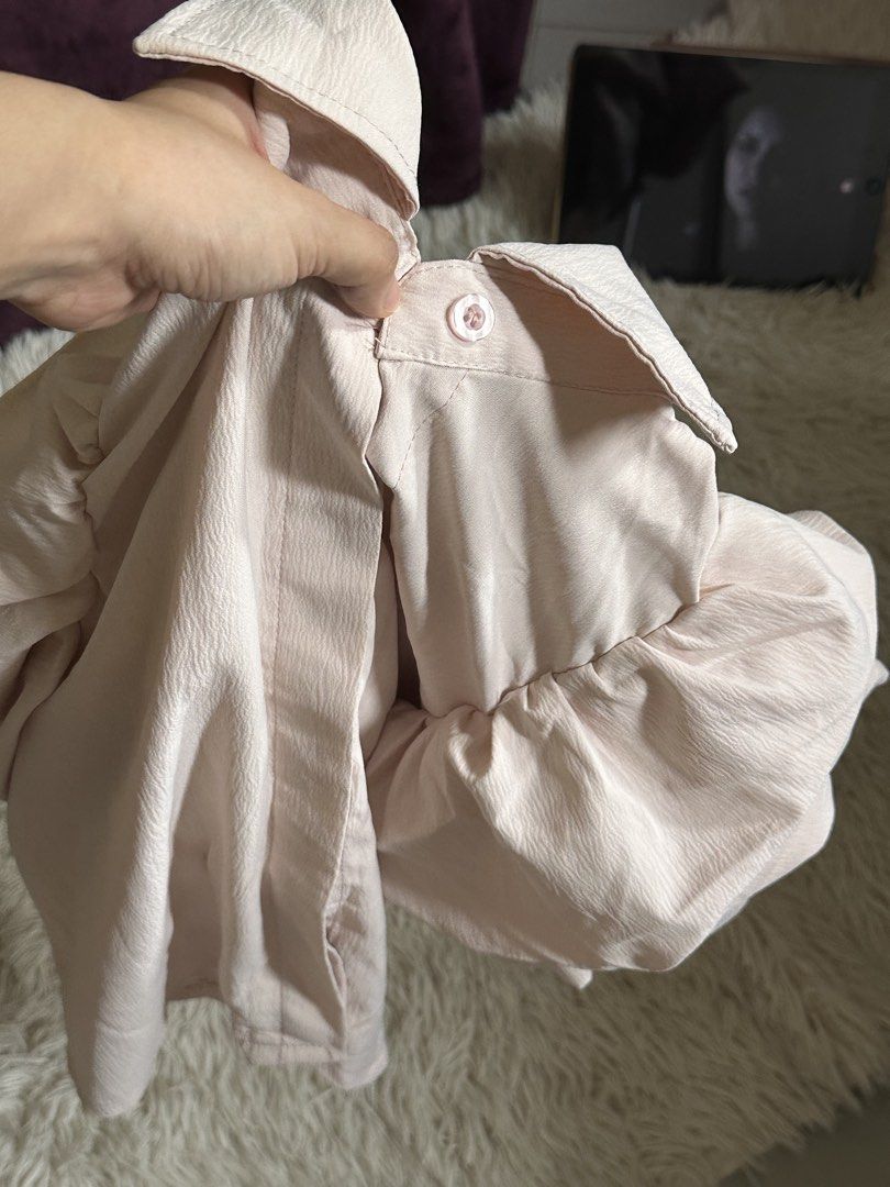 Pastel pink button down blouse with puff sleeves (Category: Blouses) located in Taguig. Submitted by appatheseller (Listing ID 1470846340, Image 3). Description: Fits M-L Color: Pastel pink - Style: Button-down shirt with standard collar - Sleeves: Puff sleeves with gathered details - Fabric: Soft textured fabric with a subtle sheen - Closure: Front button closure - Versatility: Pairs easily with skirts or high-waisted jeans - Condition: Clean fi
