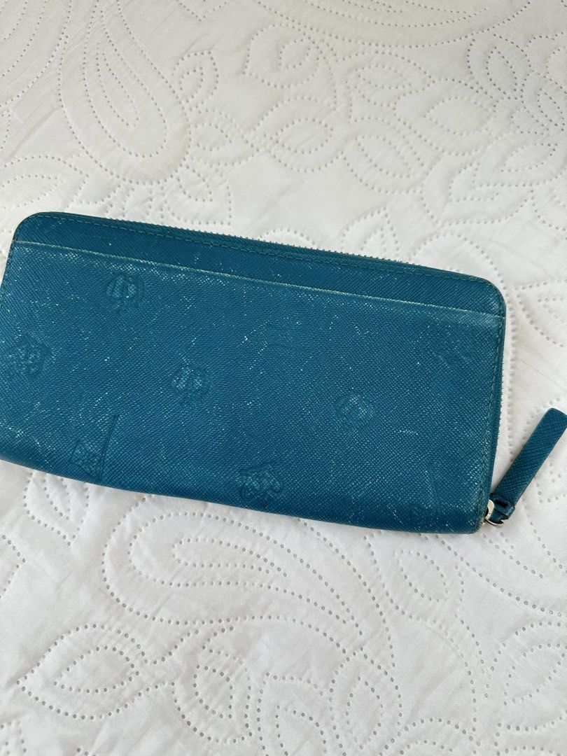 Paul Smith Teal Blue Zip Around Long Wallet (Category: Wallets & Card holders) located in Batangas. Submitted by enyahsnivl56498 (Listing ID 1470768867, Image 3). Description: - Brand: Paul Smith - Color: Teal blue - Material: Textured leather with subtle embossed patterns - Hardware: Silver-tone hardware and zipper pull - Closure: Full zip-around closure for security - Storage: Exterior back slip pocket for quick-access cards - Condition: Clean 