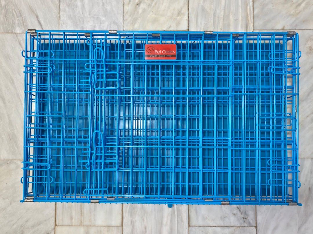 Pet Crates Blue Foldable Metal Cage with Tray (Category: Homes & Other Pet Accessories) located in Lipa City. Submitted by annekn (Listing ID 1470749789, Image 1). Description: - Durable pet crate suitable for small to medium dogs or cats - Includes a matching removable plastic tray at the bottom for easy cleaning - Folds completely flat with a built-in carrying handle for convenient storage and transport - Features a secure latch closure to keep