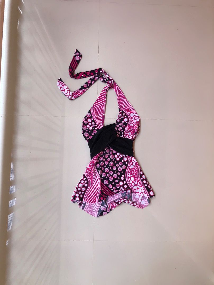Pink and Black Halter Top with Polka Dot Pattern (Category: Sleeveless) located in Davao. Submitted by christ07_fox (Listing ID 1470899143, Image 1). Description: - Trendy pink and black halter top with a bold polka dot and stripe pattern - Features a chic solid black draped band across the front - Secure and adjustable tie-neck closure - Lightweight, breathable fabric ideal for summer or night outs - Versatile piece that looks great with jeans o