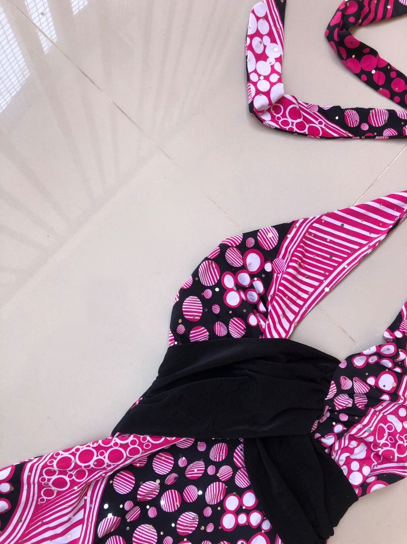 Pink and Black Halter Top with Polka Dot Pattern (Category: Sleeveless) located in Davao. Submitted by christ07_fox (Listing ID 1470899143, Image 2). Description: - Trendy pink and black halter top with a bold polka dot and stripe pattern - Features a chic solid black draped band across the front - Secure and adjustable tie-neck closure - Lightweight, breathable fabric ideal for summer or night outs - Versatile piece that looks great with jeans o