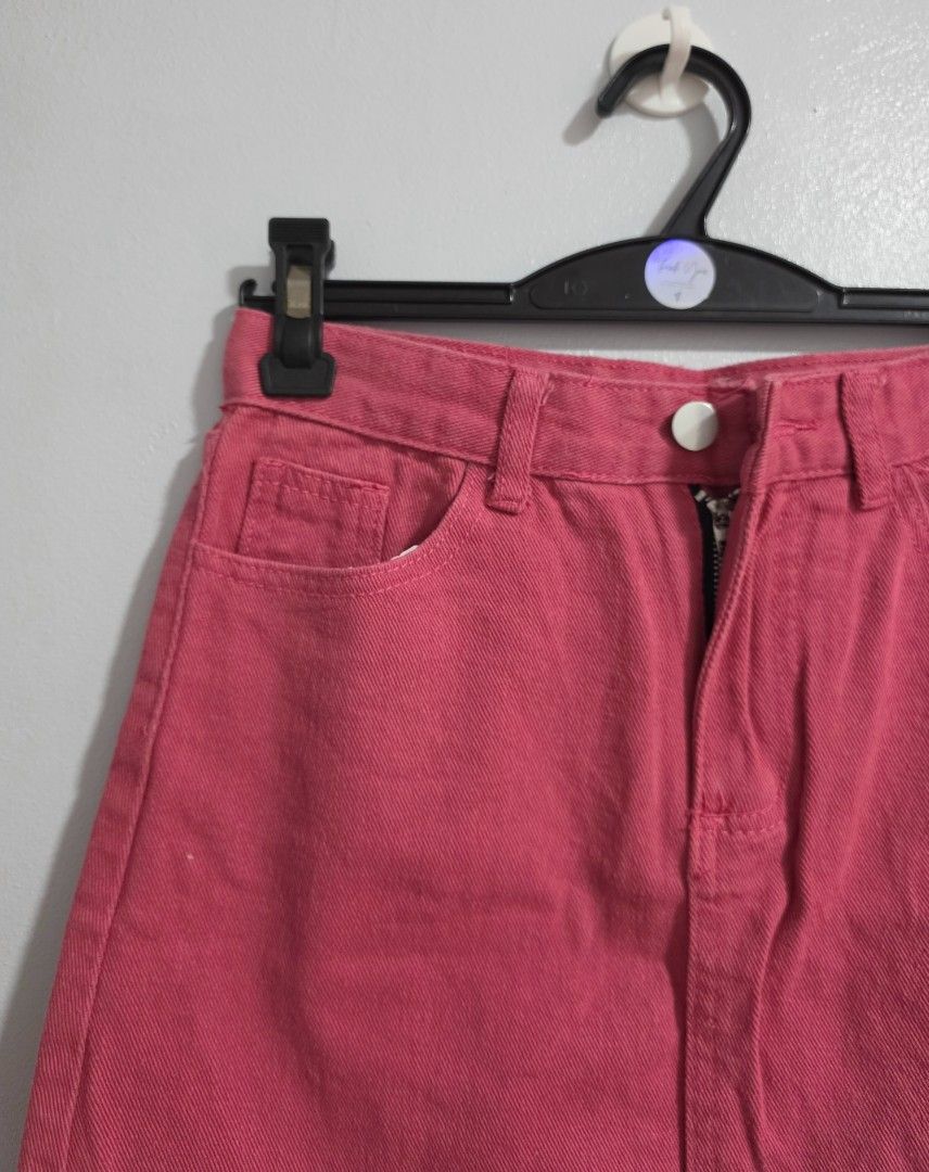 Pink Denim Skirt (Category: Skirts) located in Paranaque City. Submitted by franinnashop (Listing ID 1470796210, Image 3). Description: Declutter - Color: Bright pink - Closure: Front button and zipper - Pockets: Classic five-pocket design with back pockets - Features: Belt loops and straight hemline - Measurements: 24" waist, 32" hip, 15" length - Condition: Brand new / Excellent.