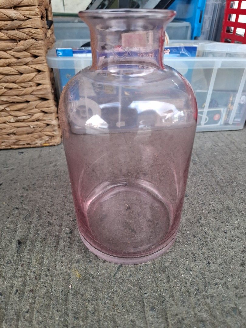 Pink Glass Vase (Category: Vases & Decorative Bowls) located in Manila. Submitted by rocksolid227 (Listing ID 1470794250, Image 3). Description: - Color & Material: Transparent pink glass - Design: Wide cylindrical body with a flared rim - Features: Heavy bottom for extra stability, smooth surface - Condition: Excellent, no chips or cracks - Use: Ideal for fresh flowers or standalone display.