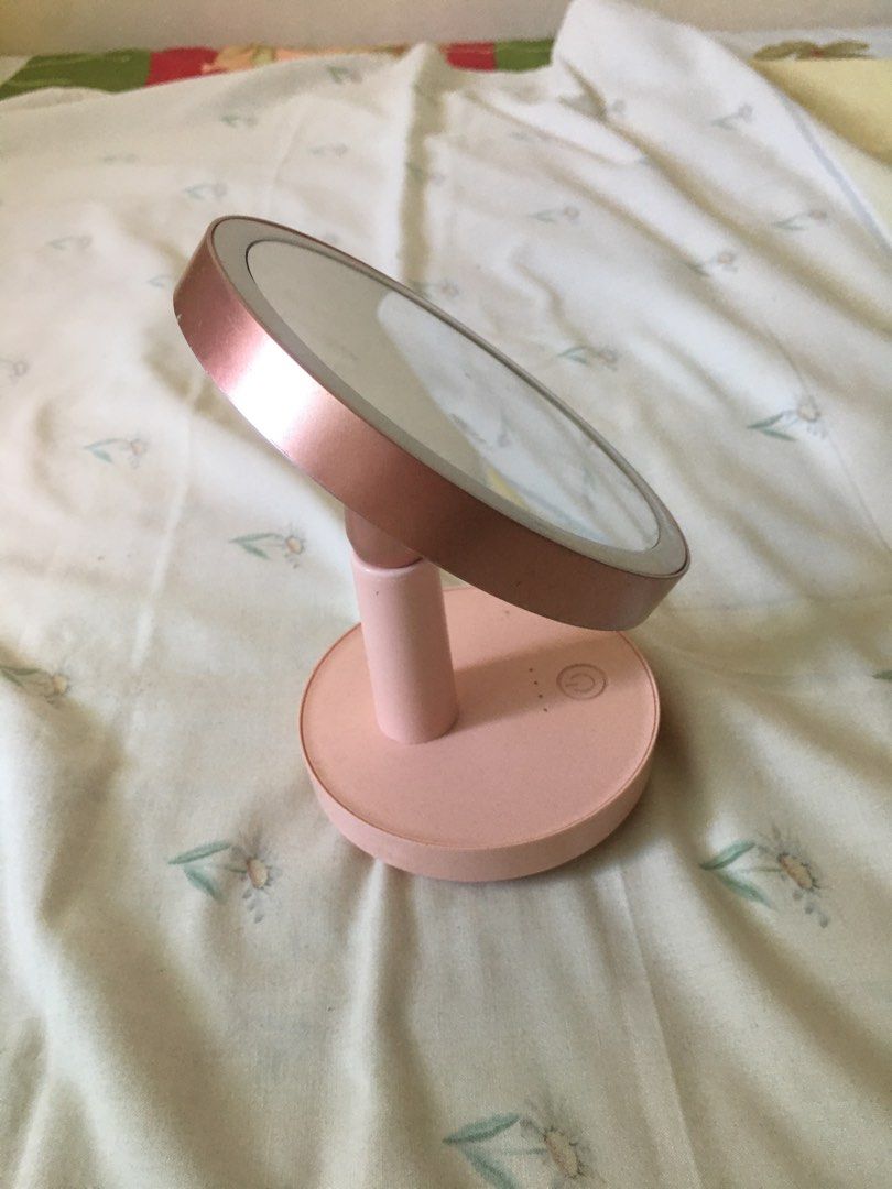Pink LED Vanity Makeup Mirror with Light (Category: Mirrors) located in Cabuyao City. Submitted by 4everblooms (Listing ID 1470774256, Image 3). Description: - Stylish moon and star pattern printed on the back - Powered via side Micro-USB port or batteries (compartment at the bottom) (free Micro-USB cord) - Equipped with anti-slip rubber feet for stable placement - Bought from SM for ₱599 - Issues: minimal scratches and fading (see last photos).
