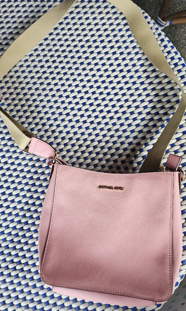 Pink Michael Kors Jet Setter Bag (Category: Luxury Bags & Wallets) located in Quezon City. Submitted by liz11888 (Listing ID 1470870005, Image 1). Description: Used 2x RFS: Too small No Flaws Perfect for Malling or Quick Errands 100% Authentic Payment via Gcash or Online Bank Delivery c/o buyer.