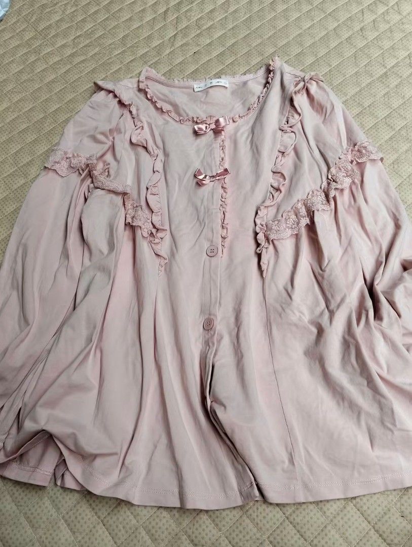 Pink Ruffle Long Sleeve Button Up Blouse (Category: Longsleeves) located in Caloocan City. Submitted by emmanmanila (Listing ID 1470845796, Image 1). Description: - Color: Soft pink - Design: Front button-down closure with pleated front panels - Details: Delicate lace trim on shoulders and chest with cute satin ribbon bows - Material: Smooth, soft, and comfortable fabric - Styling: Perfect to pair with skirts or high-waisted pants for a sweet, ca