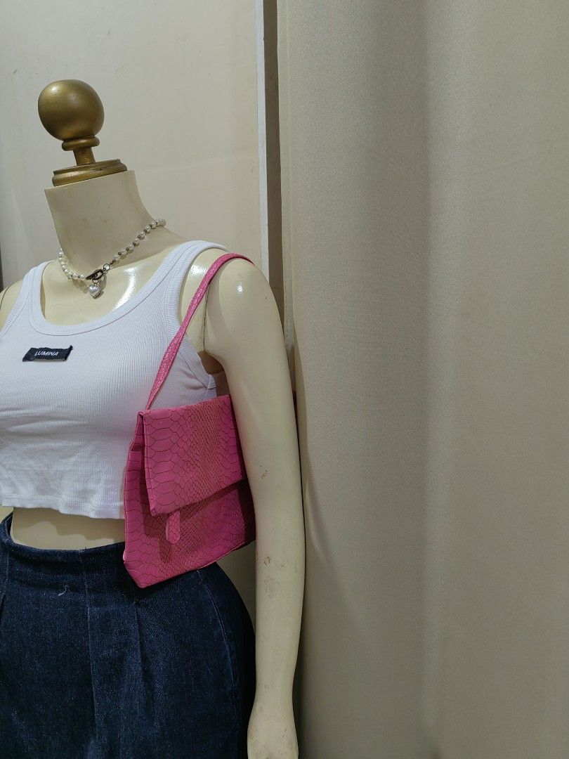 Pink snakeskin shoulder bag (Category: Shoulder Bags) located in Makati City. Submitted by prelovedtreatedwithlove (Listing ID 1470867193, Image 1). Description: - Color: Bright pink - Material: Faux snakeskin texture - Design: Foldover flap with a clean, structured silhouette - Strap: Single strap, comfortable for shoulder or hand carry - Style: Fun statement piece to elevate any outfit No issue.