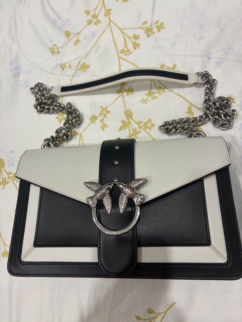 PINKO Love Evolution Shoulder Bag Limited edition (Category: Cross-body Bags) located in Santa Rosa. Submitted by moriza22 (Listing ID 1470894554, Image 1). Description: Material Natural leather Color white&black Brands Pinko Height: 16.5 cm Width: 7 cm Length: 27 cm.