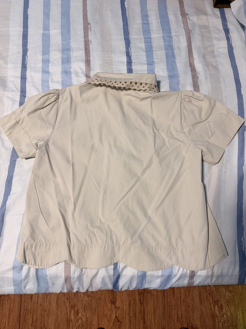 Plains & Prints Cream Blouse with Scalloped Hem (Category: Blouses) located in Valenzuela. Submitted by criszaconcepcion (Listing ID 1470896111, Image 2). Description: - Brand: Plains & Prints - Color: Cream - Style: Short-sleeve blouse with gathered puff sleeves - Details: Intricate lace collar with cutout patterns, hidden button-down front, and a scalloped hem -bdo payment What you see is what you get No when worn.