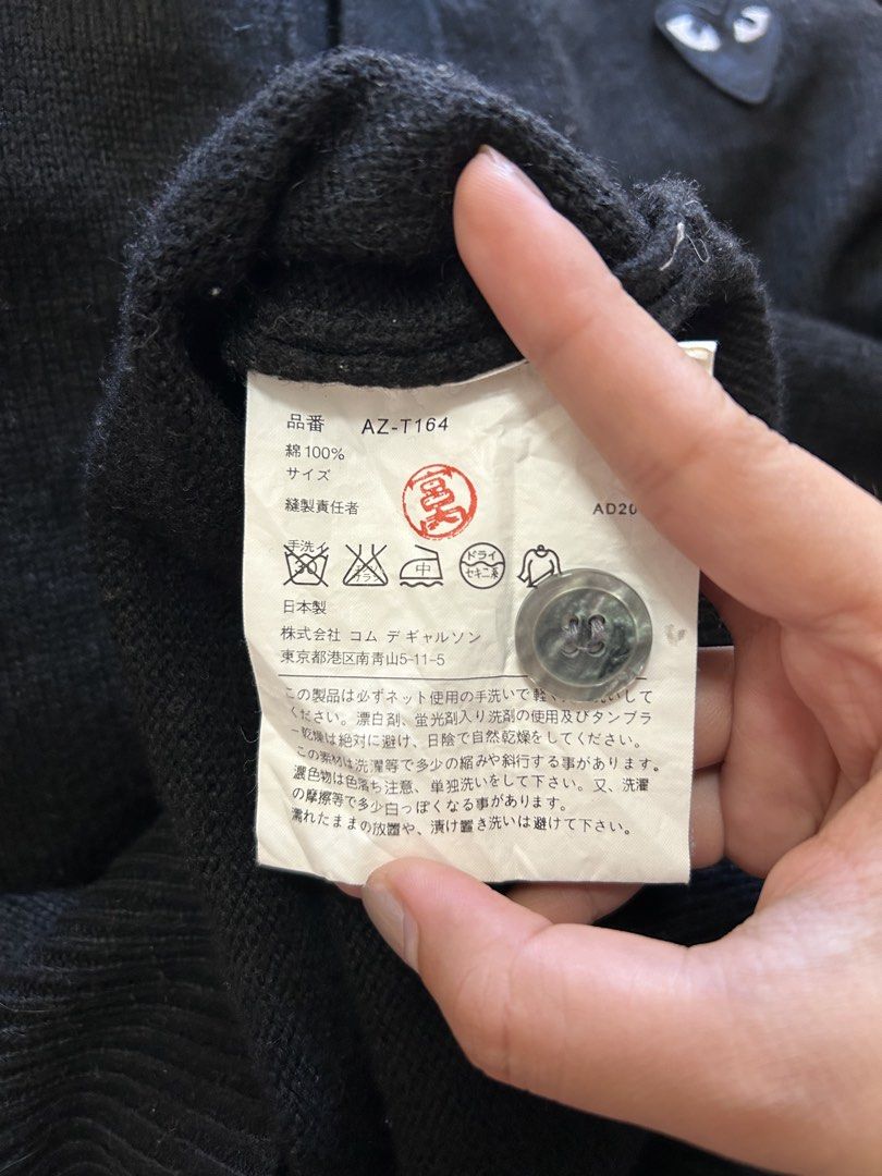 Play Comme des Garcons Black Cardigan Size L (Category: Coats, Jackets and Outerwear) located in Bacolod City. Submitted by gilbertgon94115 (Listing ID 1470809537, Image 3). Description: - Brand: Play Comme des Garçons - Item: Classic V-neck button-down cardigan - Color: Black - Size: Large (L) - Dimes: Width 19 ; Length 25 - Material: 100% Cotton, Made in Japan - Details: Iconic embroidered black heart patch with white eyes, ribbed cuffs and hem