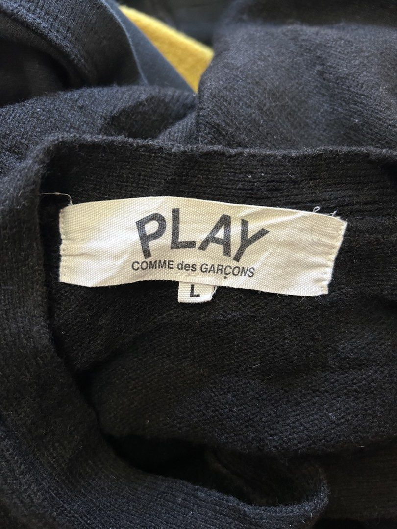 Play Comme des Garcons Black Cardigan Size L (Category: Coats, Jackets and Outerwear) located in Bacolod City. Submitted by gilbertgon94115 (Listing ID 1470809537, Image 2). Description: - Brand: Play Comme des Garçons - Item: Classic V-neck button-down cardigan - Color: Black - Size: Large (L) - Dimes: Width 19 ; Length 25 - Material: 100% Cotton, Made in Japan - Details: Iconic embroidered black heart patch with white eyes, ribbed cuffs and hem