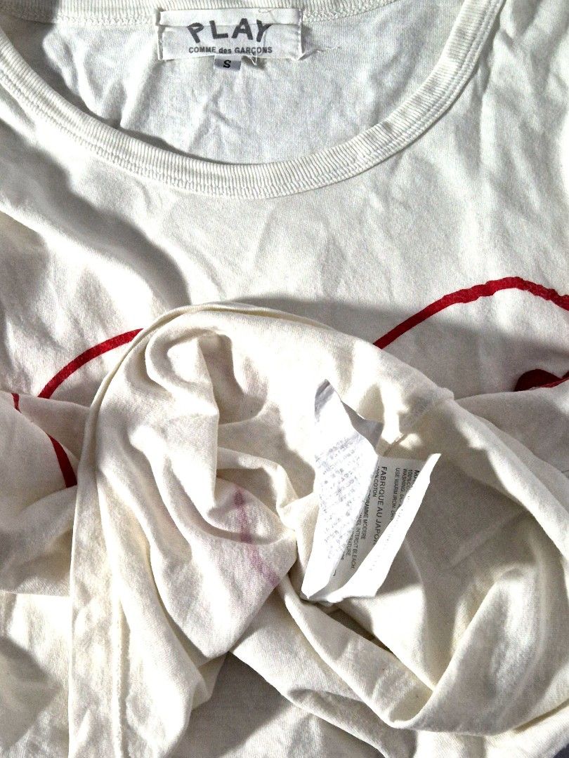 PLAY Comme des Garçons Tee (S) (Category: Shirts) located in Antipolo. Submitted by saribymonica (Listing ID 1470863440, Image 3). Description: Size: Small • Stored in the cabinet, so the item may be wrinkled and may need ironing. • Colors may vary slightly due to lighting and screen settings. • Please check all photos carefully before purchasing. • Sold as is. No returns, refunds, or exchanges once sold. RFS: Decluttering.