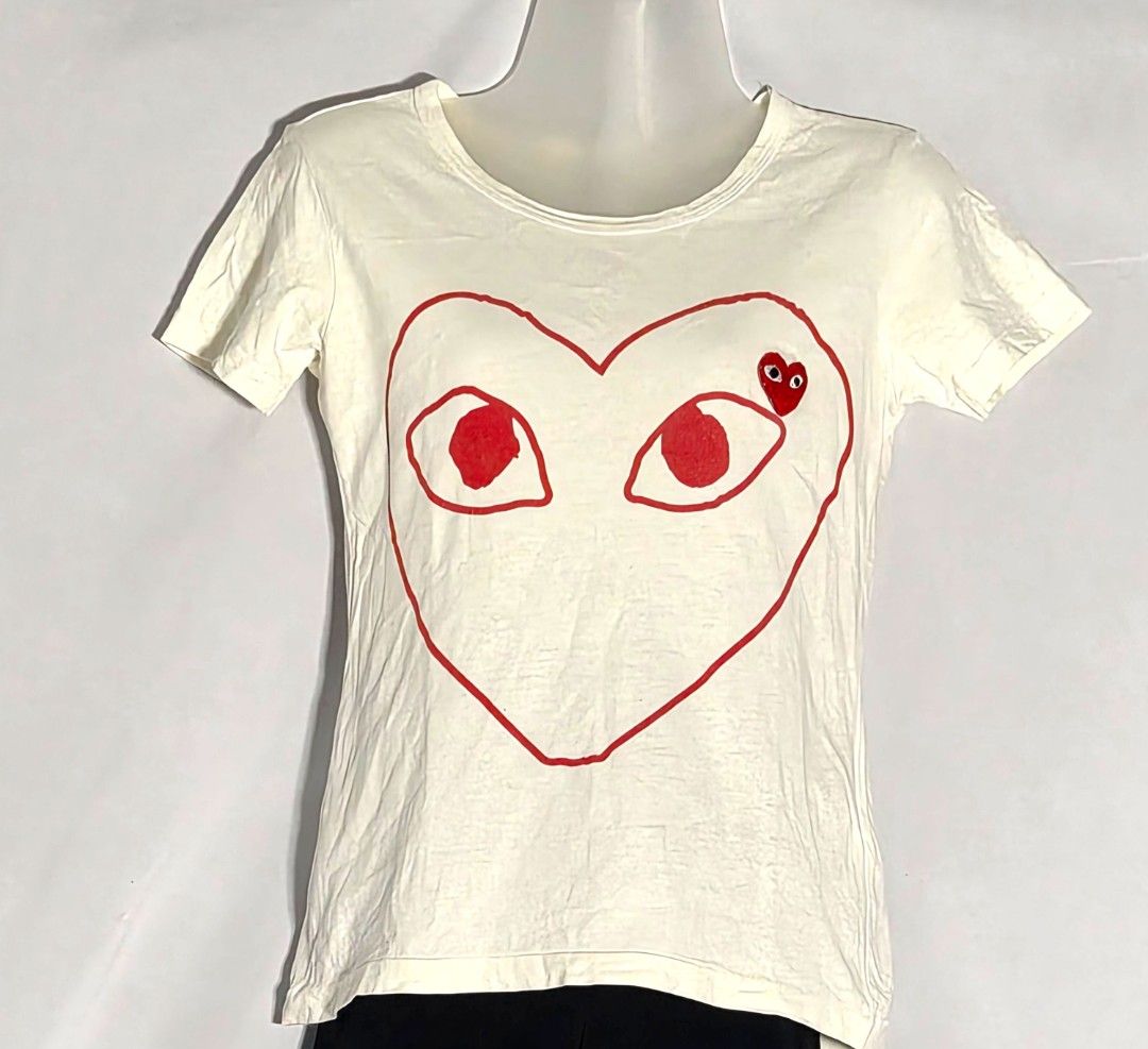 PLAY Comme des Garçons Tee (S) (Category: Shirts) located in Antipolo. Submitted by saribymonica (Listing ID 1470863440, Image 1). Description: Size: Small • Stored in the cabinet, so the item may be wrinkled and may need ironing. • Colors may vary slightly due to lighting and screen settings. • Please check all photos carefully before purchasing. • Sold as is. No returns, refunds, or exchanges once sold. RFS: Decluttering.