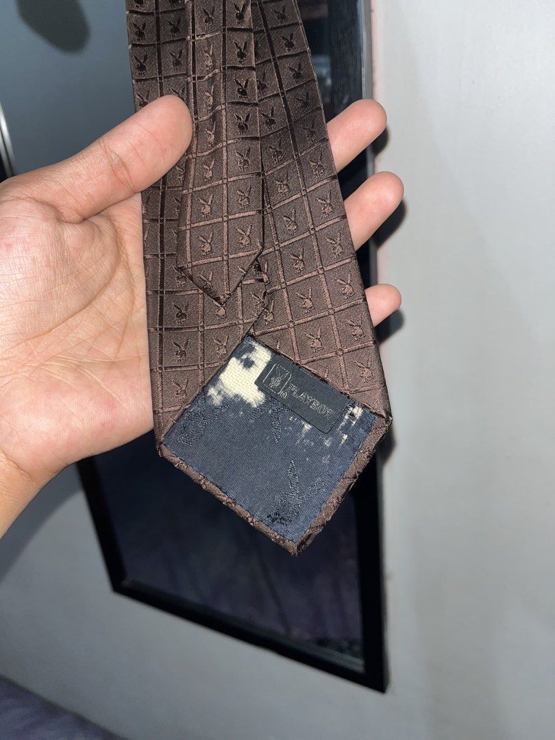 Playboy Brown Monogram Grid Pattern Necktie (Category: Ties) located in San Pedro. Submitted by thethirdwear (Listing ID 1470899439, Image 2). Description: Playboy neck tie See photos for the issue Still in great condition Color rate 9/10 ₱650.
