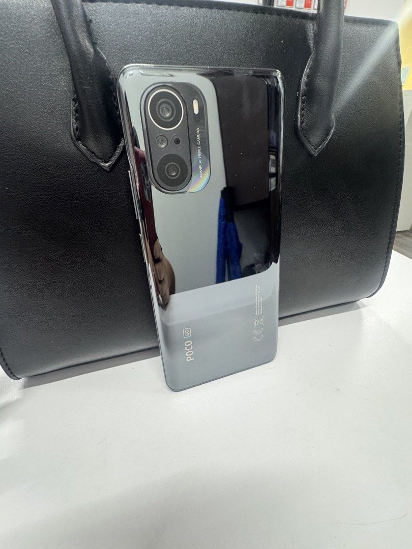 POCO F3 5G 256GB (Category: Xiaomi) located in Manila. Submitted by ajeelity (Listing ID 1470836777, Image 2). Description: - Brand/Model: POCO F3 5G - Storage: 256GB - Software: MIUI Global 14.0.4 - Color/Design: Sleek silver/grey finish with glossy back panel - Condition: Excellent, clean screen and body - Meetup Locations: Ayala Triangle, Circuit Makati, BGC near OBHS.