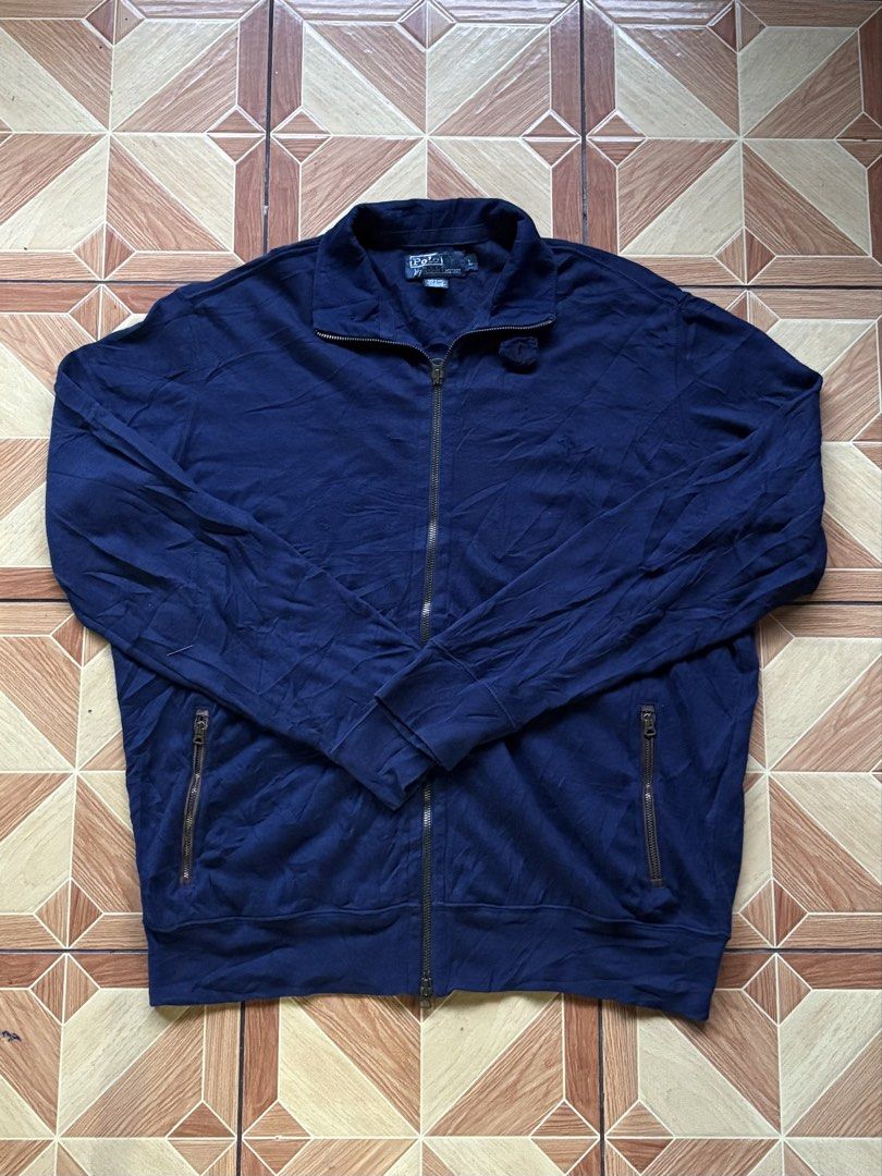 Polo Ralph Lauren Navy Zip Jacket Size L (Category: Coats, Jackets and Outerwear) located in Baybay. Submitted by jhondhelbe76855 (Listing ID 1470801874, Image 1). Description: - Brand: Polo Ralph Lauren - Color: Navy Blue - Size: Large - Style: Full-zip jacket with collar neck - Features: Front zipper pockets, ribbed cuffs and hem - Condition/Vibe: Classic staple piece, perfect for layering over tees or hoodies in cooler weather.