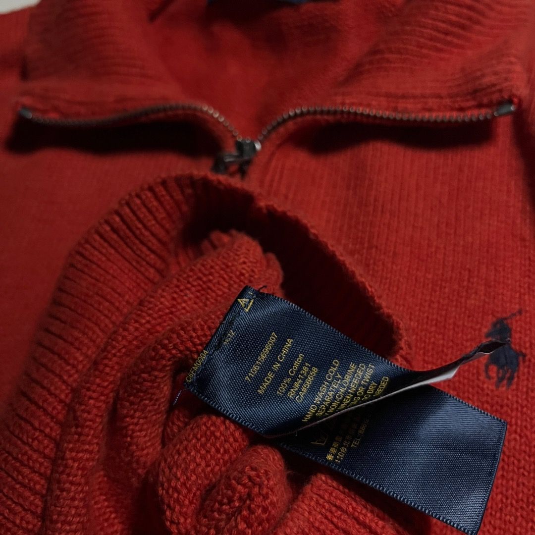 Polo Ralph Lauren Orange Half Zip Sweater (Category: Coats, Jackets and Outerwear) located in Caloocan City. Submitted by achilles_grails (Listing ID 1470833418, Image 3). Description: - Brand: Polo Ralph Lauren - Color: Bright red with navy blue embroidered pony logo - Style: Half-zip sweater with metal zipper and leather pull tab - Details: Ribbed collar, cuffs, and hem - Material: Warm, high-quality knit fabric - Condition: Excellent, with cle