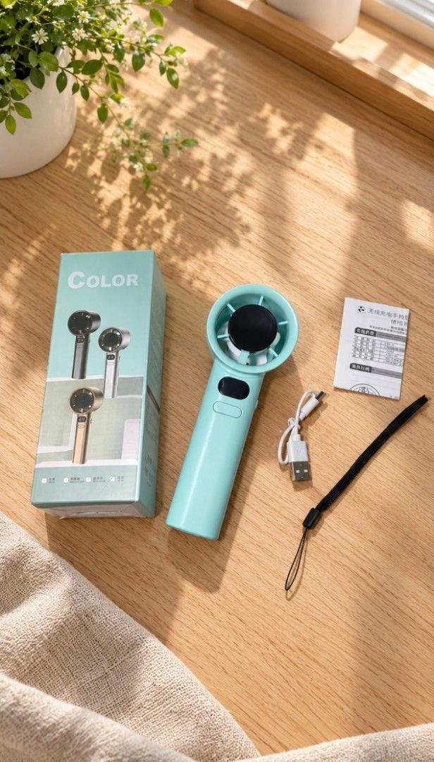 Portable Handheld Fan (Category: Fans) located in Imus. Submitted by _justrandomstuff (Listing ID 1470812751, Image 1). Description: - Color: Mint Green - Type: Portable handheld fan - Power: Rechargeable (USB cable included) - Design: Compact and bag-friendly - Inclusions: Original retail box, manual, and wrist lanyard strap.