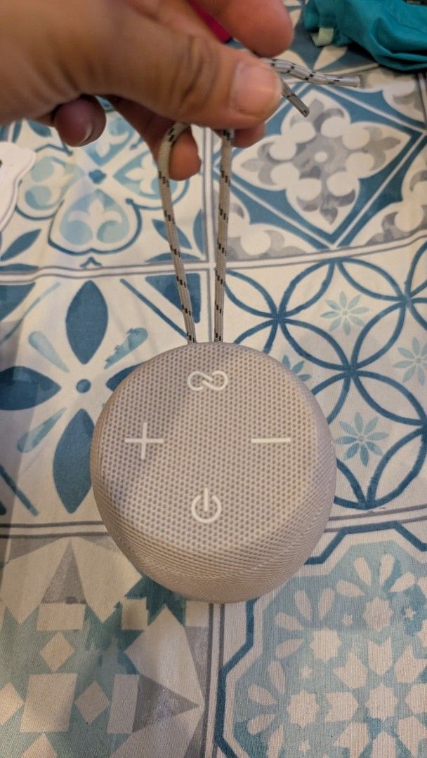 Portable Wireless Speaker and Earbuds Set (Category: Soundbars, Speakers & Amplifiers) located in Manila. Submitted by alypacis06 (Listing ID 1470767029, Image 3). Description: - Sleek beige cylindrical Bluetooth speaker with fabric mesh and carrying strap - Easy-access top controls for volume, power, and pairing - Versatile connectivity: TF card slot, AUX, micro-USB, and standard USB port - Includes matching white wireless charging case with ope