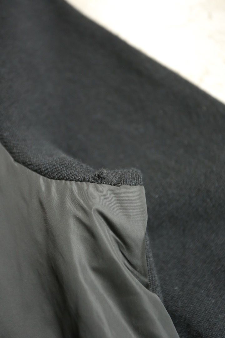 Prada - Wool-Trimmed Blouson (Category: Coats, Jackets and Outerwear) located in Manila. Submitted by graymatter_ (Listing ID 1470827854, Image 3). Description: Prada - Wool-Trimmed Blouson circa 2001-2005 Tagged Size: L Condition: 9/10 Flaws: Minor Tear on 1 Pit Material: 100% Nylon, 70% Lana Wool, 30% Cashmere Zipper: Riri Made in: Italy Dimensions Length: 26.5 Width: 22.5 Shoulder: 18 Sleeve: 29.