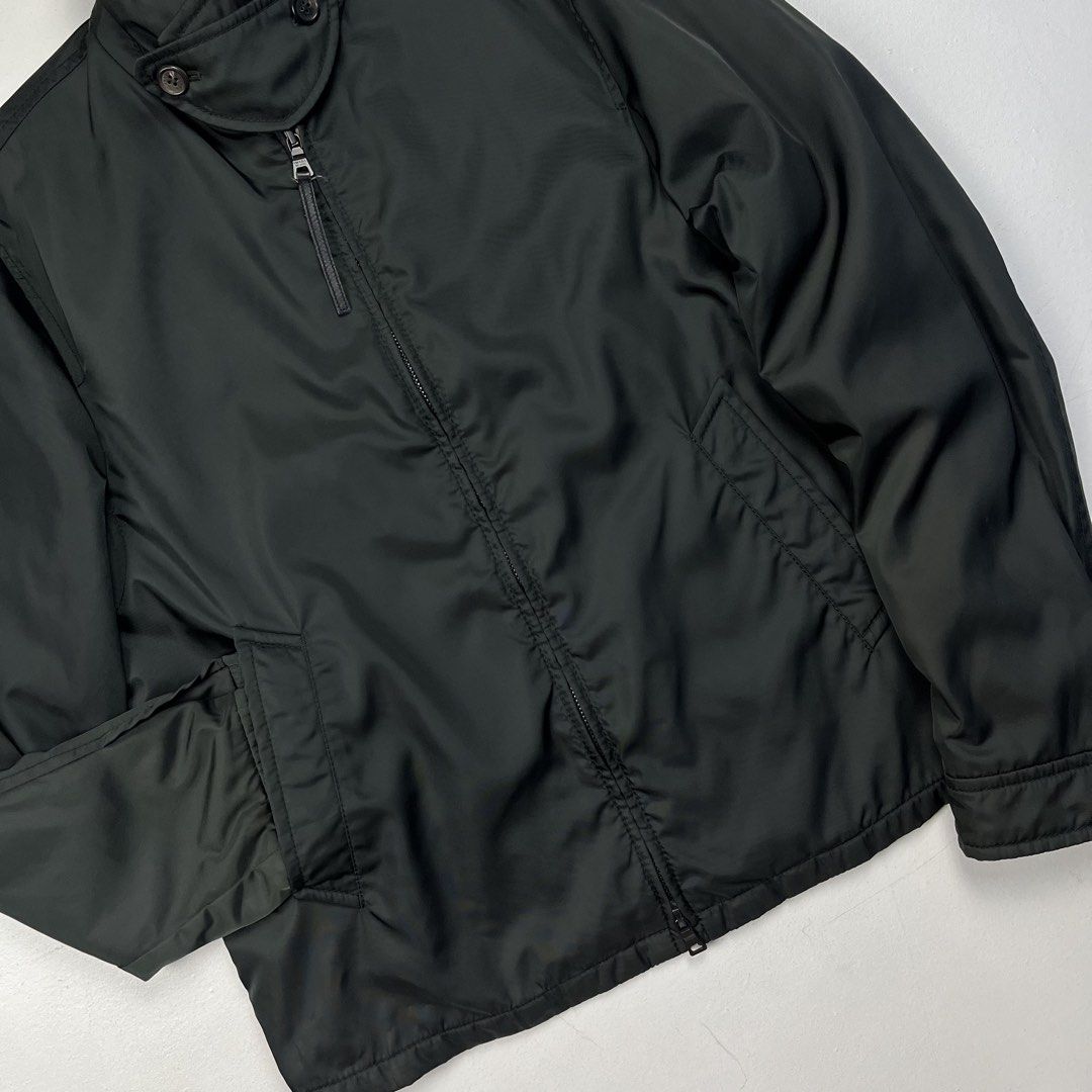 Prada Early 2000s Nylon Insulated Harrington Jacket (Category: Luxury Apparel) located in Quezon City. Submitted by forgarments (Listing ID 1470849988, Image 3). Description: Prada Early 2000s Nylon Insulated Harrington Jacket Excellent Condition Size: Medium Shoulder: 19 Inches Chest width: 23 Inches Sleeve: 27 Inches Length: 27 Inches Hem: 21 Inches - 100% Nylon shell that like has a iridescent effect | 100% Polyester padding - Made in Italy.