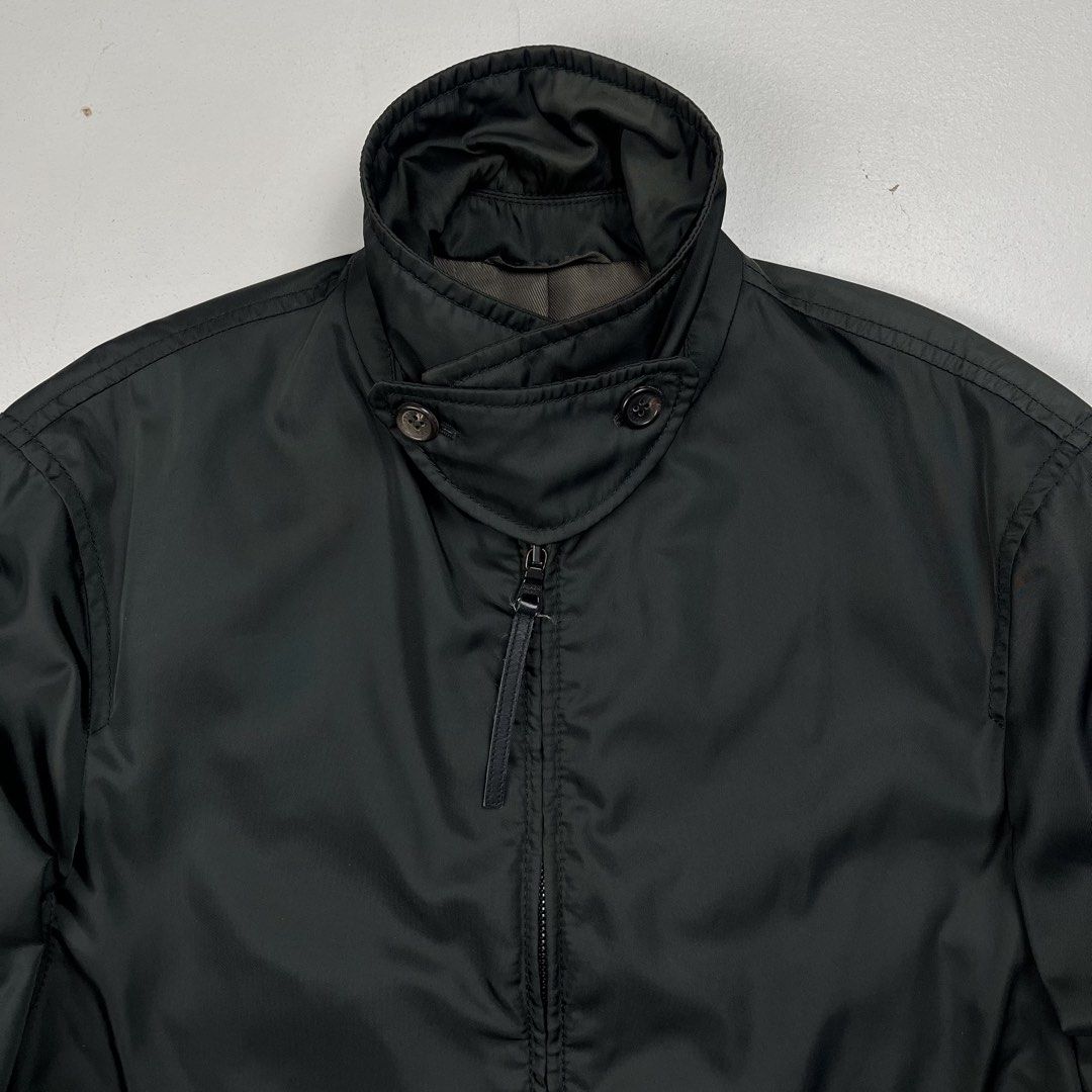 Prada Early 2000s Nylon Insulated Harrington Jacket (Category: Luxury Apparel) located in Quezon City. Submitted by forgarments (Listing ID 1470849988, Image 2). Description: Prada Early 2000s Nylon Insulated Harrington Jacket Excellent Condition Size: Medium Shoulder: 19 Inches Chest width: 23 Inches Sleeve: 27 Inches Length: 27 Inches Hem: 21 Inches - 100% Nylon shell that like has a iridescent effect | 100% Polyester padding - Made in Italy.