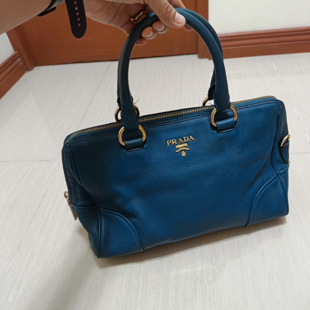 PRADA Leather Shoulder Bag Blue (Category: Luxury Bags & Wallets) located in Nasugbu. Submitted by staffpicks1515 (Listing ID 1470827813, Image 2). Description: - Authentic Prada leather shoulder bag in a stunning blue shade - Elegant gold-tone hardware with secure zip closure - Features double top handles (please note: original sling strap is missing) - Blue fabric-lined interior complete with convenient pockets - Crafted in Italy - Condition: S