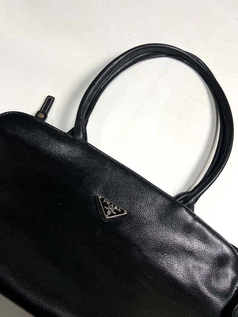‎“PRADA MILANO BONNIE MEDIUM HANDBAG (Category: Shoulder Bags) located in Taguig. Submitted by ldm.ph (Listing ID 1470914824, Image 3). Description: ‎(LDM-A-0049) ‎Dimensions Inches width:15 ‎Inches length:8 ‎Condition: EXCELLENT ‎Color rate:9.5 ‎Flaws:❌ ‎(READY TO WEAR).