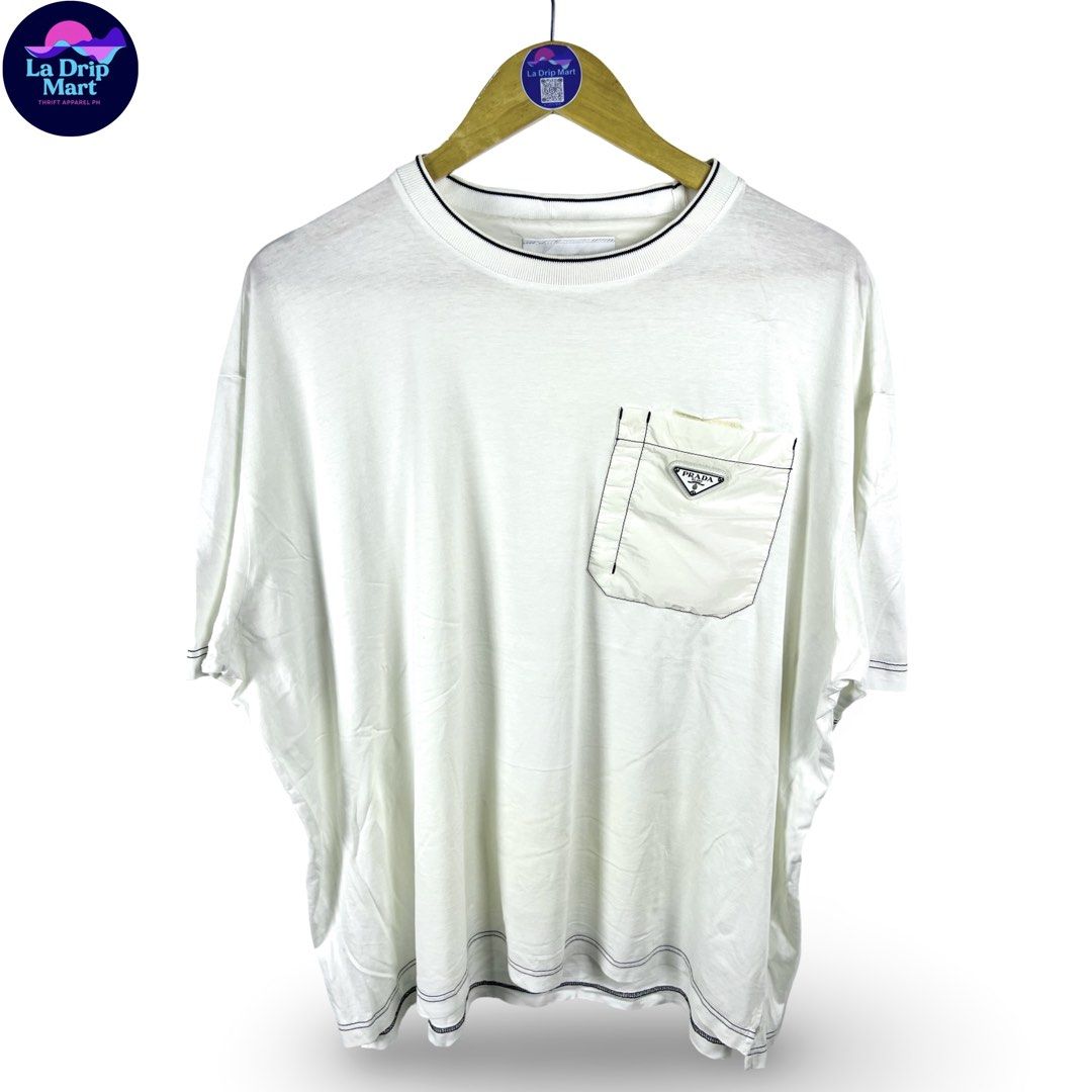 ‎“PRADA MILANO” RE-NYLON ZIPPED POCKET TEE (Category: Tshirts & Polo Shirts ) located in Taguig. Submitted by ldm.ph (Listing ID 1470743896, Image 1). Description: ‎(LDM-C-0293) ‎Size:ACTUAL FIT:XL-XXL ‎Dimensions ‎Inches width:27 ‎Inches length:27 ‎Condition: GOOD ‎Color rate:8.5 ‎Flaws:repaired pinhole ‎(READY TO WEAR).