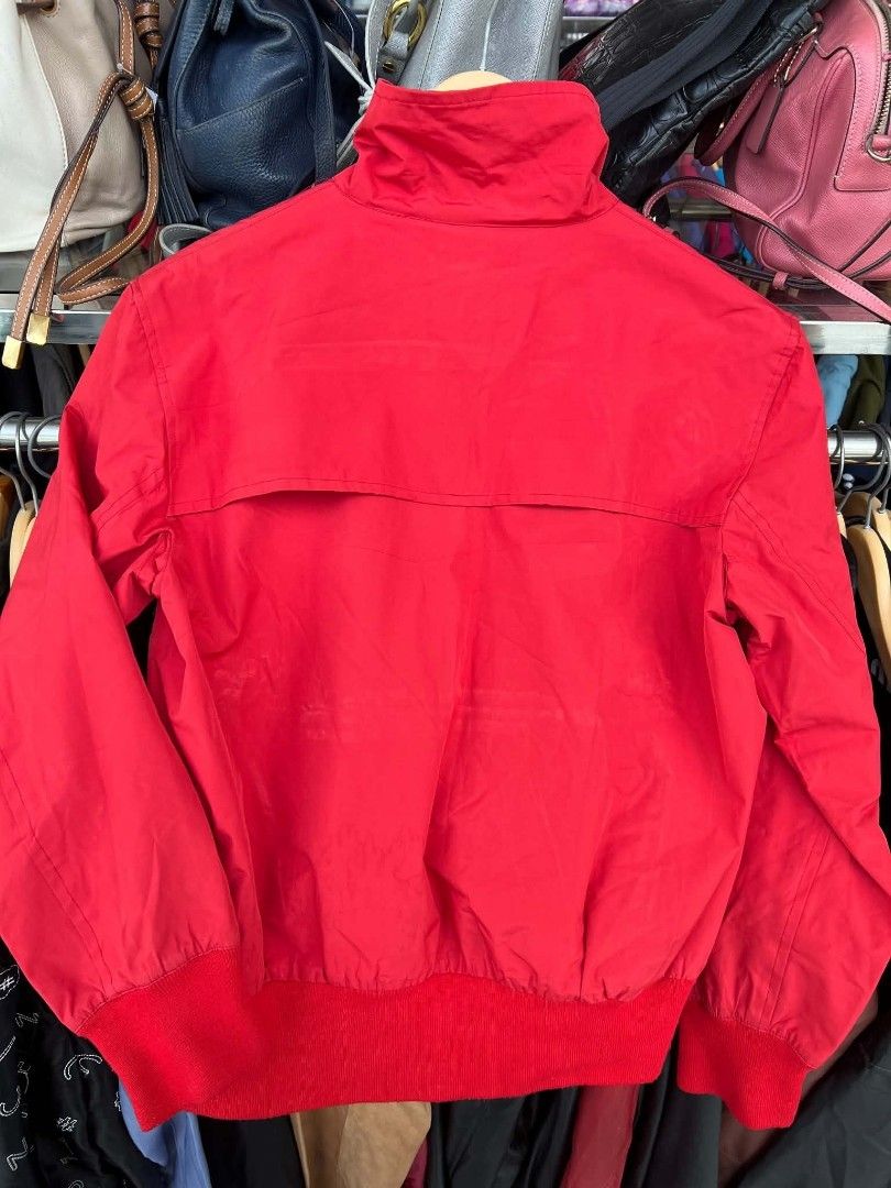 Prada Red Nylon Bomber Jacket Art.SGV126 (Category: Coats, Jackets and Outerwear) located in Urdaneta. Submitted by jayceegarage (Listing ID 1470882000, Image 2). Description: - Brand: Prada - Item: Nylon Bomber Jacket - Color: Red - Size: Medium - Material: 100% Polyester - Made in Italy - Design: Stand collar with ring zip, ribbed red cuffs and hem, branded red fabric tag on right sleeve - Interior: Printed logo mesh lining with patterned accen