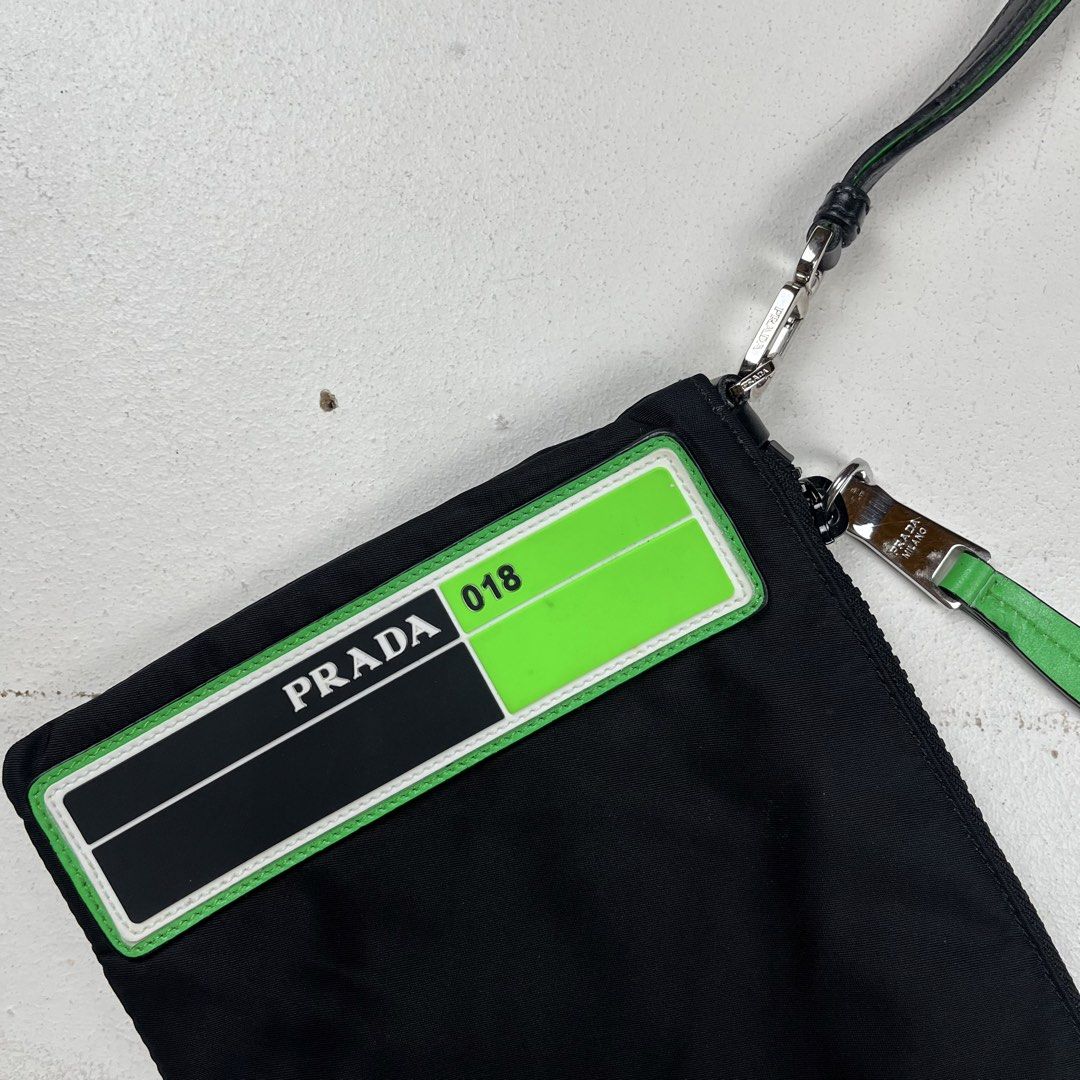 Prada Tessuto Nylon Clutch / Pouch (Category: Luxury Bags & Wallets) located in Quezon City. Submitted by forgarments (Listing ID 1470859979, Image 2). Description: Prada Tessuto Nylon Clutch / Pouch Excellent Condition Width: 10.5 Inches Height: 7 Inches - Made in Italy.