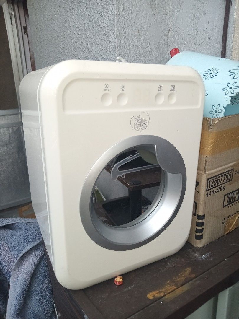 Precious Moments UV Sterilizer PM 3602 (Category: Breastfeeding & Bottle Feeding) located in Manila. Submitted by calmriver_117aa0 (Listing ID 1470809222, Image 2). Description: - Brand/Model: Precious Moments UV Sterilizer, Model PM 3602 - Condition: Fully working, with standard signs of handling on the outer plastic casing - Voltage: 220-240V, 50Hz - Power Usage: 10W (sterile mode) / 80W (dry mode) - Interior: Stainless steel finish with includ