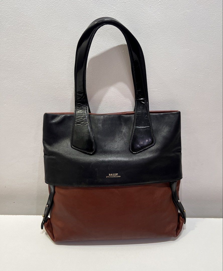 Pre-loved Bally Leather Tote Bag (Category: Luxury Bags & Wallets) located in Cebu City. Submitted by brandedcorner_ph (Listing ID 1470923575, Image 1). Description: Pre-loved ((B))ally Leather Tote Bag 100% Authentic or money back Condition • Excellent condition • No flaws Product Details •Color: Black & brown •Hardware: Gold tone •Material: Leather •Approximate Dimensions in inches: H12 x W15 x D3.5 Color may vary due to lighting. PM for more p